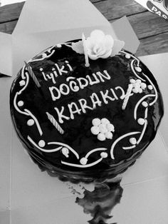 a black and white photo of a birthday cake with the words i love you, doudun karabak written on it