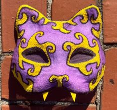 Looking for the perfect cat mask to complete your Therian or quadrobics look? Look no further than our handmade cat mask! Perfect for quadrobics, cosplay, anime, and Halloween costumes. Each mask is 100% handmade with high-quality felt, paint, fur, and foam. It takes 4 hours to create each mask, ensuring attention to detail and durability. With a one-size-fits-most design, this mask is sure to be a hit with therians and quadrobists of all ages. Halloween Cat Design Mask For Costume Party, Halloween Masquerade Mask With Cat Design, Cat Design Eye Mask For Cosplay, Halloween Cosplay Cat Design Mask, Cosplay Cat Design Eye Mask, Cosplay Cat Design Mask, Halloween Masquerade Masks With Whiskers, Therian Mask, Costume Masks