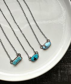 "Sterling silver necklaces, featuring beautiful turquoise stones, cut and polished by the Otteson family!  (You can see them on the show Turquoise Fever!) All of these feature 18\" chains, that have been soldered to the backplate of the design (this means the clasp will always stay at the back of your neck where it belongs!) The chains and all metal on these are 925 Sterling Silver.   The chains have been oxidized to highlight these gorgeous stones. Entirely crafted from solid 925 Sterling silver  Slowly forged by hand, these are one of a kind pieces of jewelry Please make your selection from the second photo, only one of each available.  Ready to ship, with fast and free shipping Handmade with lots of love in my mountain studio in California" Sterling Silver Turquoise Necklace With Adjustable Chain, Silver And Turquoise Jewelry, Turquoise Bar Necklace, Silversmith Jewelry, Charm Ideas, Silversmithing Jewelry, Nashville Outfit, Silver Smithing, Turquoise Bar