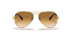 Discover the meticulous craftsmanship that unites style and optical functionality in Ray-Ban Aviator Gradient sunglasses. These pilot-shaped glasses feature a polished gold metal frame that exudes timeless elegance. The gradient light brown lenses add a touch of sophistication and enhance your visual experience, making these shades an ideal choice for everyday wear. Embrace the iconic style of Ray-Ban with these sunglasses. Available with prescription lenses. Light Brown Lenses, Gradient Light, Celebrity Sunglasses, Ray Ban Aviator, Heart Face, Glasses Brands, Pilot Sunglasses, Man Ray, Ray Ban Aviators