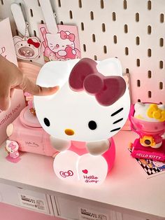 a hello kitty lamp sitting on top of a desk