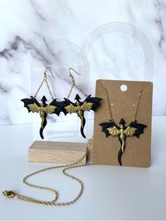 These handmade dragon earrings are one of a kind! They are lightweight and comfortable to wear all day long! All metal in earrings and necklace are surgical stainless steel so they are tarnish resistant and hypoallergenic. Care Instructions: Try not to excessively bend or stress earrings. Don't sleep, swim, work out, etc. while wearing them. Handmade in Kansas :) Themed Black Metal Jewelry, Themed Black Jewelry As Gift, Themed Black Jewelry Gift, Themed Jewelry For Halloween Cosplay, Black Dragon Design Jewelry Gift, Fantasy Earrings For Halloween Gift, Black Jewelry With Dragon Design For Gift, Black Jewelry For Halloween Fantasy Events, Black Earrings For Halloween Cosplay