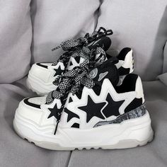 Step up your sneaker game with these Starry Casual Platform Shoes. Featuring a bold design with black star appliqués, these shoes are perfect for making a statement. The chunky platform sole provides both height and comfort, ensuring you can wear them all day with ease. The unique lacing system, paired with stylish black and white laces, adds a touch of flair to the overall design. Ideal for casual outings or adding an edge to your everyday look, these sneakers are a must-have for those who love Black And White Platform Shoes, Cheap Platform Shoes, Thick Platform Shoes, Snikers Shoes, Black And White Clothes, Best Shoes For Women, Star Black And White, Casual Platform Shoes, Black Platform Sneakers