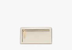 Not only does this large wallet have multiple card slots billfold compartments and zip pockets at the interior it has a very pretty exterior. In this case we think more is more. | Kate Spade Madison Large Slim Bifold Wallet, Meringue