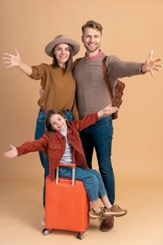 a man and woman standing next to each other with luggage