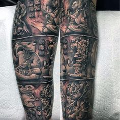 a man's legs with tattoos on them