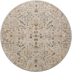 a round rug with an intricate design on the center and sides in beige, blue, yellow and green colors