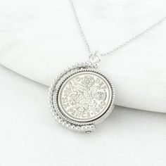 "A lucky sixpence spinner necklace displaying a genuine polished sixpence coin of your chosen date. Featuring a genuine sixpence coin, this vintage inspired necklace makes for a memorable and thoughtful gift for anyone celebrating a birthday or another milestone. The sixpence is traditionally given as a symbol of good luck so would make a fantastic gift for a wedding, birthday or any other special occasion. It is something that can be worn and kept forever. Our Sixpence Spinner Necklace comes pa Classic Charm Necklaces With Coin Pendant, Antique Coin Necklace For Anniversary, Classic Charm Necklace With Coin Medallion, Antique Coin Pendant Necklace For Anniversary, Antique Necklace With Coin Pendant For Anniversary, Classic Coin Pendant Necklace As Gift, Classic Charm Necklaces With Coin Medallion Pendant, Antique Coin Necklaces For Anniversary, Classic Medallion Necklace With Coin Pendant As Gift