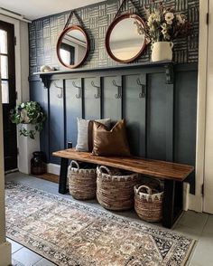 a bench with two mirrors and baskets on it