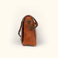 Roosevelt Buffalo Leather Satchel Messenger Bag | Amber Brown Classic Shoulder Bag With Waxed Finish, Classic Waxed Finish Shoulder Backpack, Leather Saddle Flap Bag For Everyday Use, Classic Waxed Satchel Backpack, Modern Saddle Bags For Everyday Use, Everyday Bag With Adjustable Strap In Oiled Leather, Everyday Oiled Leather Bag With Adjustable Strap, Leather Saddle Bag With Waxed Finish For Everyday Carry, Leather Saddle Bag With Waxed Finish Satchel