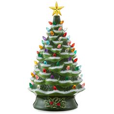 a ceramic christmas tree with lights on it's base and a star above the top