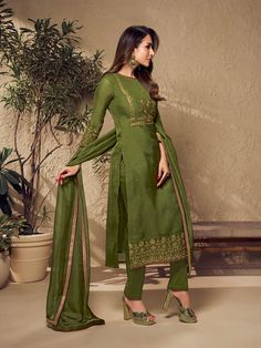 Defined by Malaika Arora's sense of fashion, this mehndi green kurta set is an epitome of grandeur and majestic artwork. Crafted using Zari work and mukaish embroidery, it features a straight top with three-quarter sleeves, a round neck and organza & shantu inner for comfort. The set includes a pair of cotton trousers and an organza dupatta with exquisite floral Zari machine weave yoke/border embroidery and taping. TOP: Organza, TOP INNER: Shantun, BOTTOM: Cotton, DUPATTA: Organza, Dry Clean Semi-stitched Pista Green Organza Traditional Wear, Embroidered Pista Green Sharara In Organza, Pista Green Embroidered Traditional Wear In Organza, Pista Green Organza Bollywood Traditional Wear, Bollywood Style Pista Green Organza Traditional Wear, Embroidered Pista Green Organza Sharara, Pista Green Bollywood Organza Traditional Wear, Embroidered Pista Green Traditional Wear In Organza, Intricate Embroidered Pista Green Organza Traditional Wear