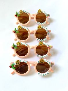 "CHRISTMAS SUNNIES!! These are so adorable-- Each pair is handcrafted by me. Using various beads, Charms, Rhinestones, and fun details!  \"HOLLY JOLLY VIBES\" * Anti-Glare * UV Protection (UVA & UVB) * Durable and shatterproof  * They open and close smoothly  * Each item is made to order and will be ready to ship in 5-7 business days! If you need your order sooner. Please check out my \"RUSH ORDER OPTION\".  https://www.etsy.com/EyeCandyandFluff/listing/1286351273/rush-my-order-please *SHOP DISCLAIMER/WAIVER!  * Do NOT let your child put the sunglasses in their mouth as beads can become detached.    Always monitor and supervise while children are wearing these. The shop assumes no responsibility for sunglasses made. Sizing--fits ages recommended 2-12 years.  If you need to make a large ord Cute Customizable Sunglasses For Gift, Playful White Sunglasses For Gift, Cute White Sunglasses For Gift, Playful White Sunglasses As Gift, Playful White Sunglasses For Gifts, Cute White Sunglasses As Gift, Cute White Sunglasses As A Gift, Pink Personalized Sunglasses For Gift, Personalized Pink Sunglasses As A Gift