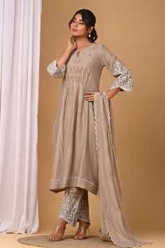 Beige pintuck pleated yoke kurta with floral embroidered sleeve. Paired with coordinating pant, inner lining and embroidered dupatta. - Aza Fashions Eid Straight Kurta With Pintucks, Eid Pintucks Straight Kurta, Traditional Sets With Pintucks For Eid, Traditional Eid Sets With Pintucks, Traditional Festive Kurta With Pintucks, Festive Traditional Kurta With Pintucks, Traditional Kurta With Pintucks For Eid, Traditional Straight Kurta With Pintucks, Traditional Pintucks Kurta