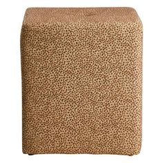 a square ottoman cover in leopard print