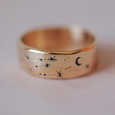 Wide Written in the Stars Ring – Sofia Zakia Celestial Brass Jewelry For Anniversary, Mystical Moon Phase Jewelry For Promise, Celestial Brass Jewelry For Wedding, Adjustable Celestial Engraved Jewelry, Magical Gold Jewelry For Promise, Mystical Yellow Gold Jewelry For Anniversary, Celestial Brass Wedding Jewelry, Hand Forged Vintage Promise Jewelry, Magical Promise Ring Jewelry