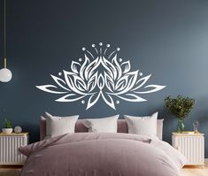 a bedroom with a large flower wall decal