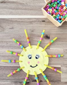 a sun craft made out of plastic beads