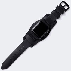 This flat, stitchless design complements the minimal look of Apple Watch series. Single layered leather watch strap with bund piece. Originally crafted for German aviators during WW2, the bund strap features an extra piece of leather within that protects the wearer's wrist from extreme temperatures. When the extra piec Black Watch Accessories With Waxed Finish, Black Waxed Finish Watch Accessories, Black Leather Strap Apple Watch Band For Everyday Use, Leather Bracelet Strap For Everyday Watch Use, Black Watch Band For Everyday Use, Black Leather Strap For Watch Accessories For Everyday Use, Adjustable Leather Watch Band With Waxed Finish, Black Watch With Bracelet Strap For Everyday Use, Black Watch Bands With Wrist Strap For Everyday Use