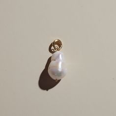 Add this Baroque Pearl Charm to any piece of jewelry for a unique touch! A simple clasp secures your charm to any piece - no sliding required. * Approx. 16mm - 32 mm. Size and shape may vary due to natural shape. Everyday Teardrop Pearl Charm Jewelry, Minimalist White Jewelry With Charms, Everyday Teardrop Charm Jewelry, Everyday Teardrop Charms Jewelry, Everyday White Charm Jewelry, Everyday White Jewelry With Charms, Everyday White Charms Jewelry, Pearl Charm Round Beads For Jewelry Making, Pearl Charm For Jewelry Making