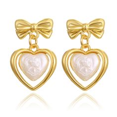 PRICES MAY VARY. Design: These gold bow heart earrings don't just feature hearts; they also have adorable gold bow studs on top, adding a whimsical and unique touch to your jewelry collection Optimal Size: The length of the bow heart earrings is 1.06 in, the width is 0.67 in, weight is 0.64 oz/pair Versatile Elegance: From date nights to casual outings, these gold bow earrings effortlessly transition from cute and casual to elegant and charming, making them a versatile addition to your wardrobe Vintage Heart Earrings, Ballerina Earrings, Gold Jewelry Earrings, Bow Jewelry, Heart Dangle Earrings, Knot Earrings, Bow Earrings, Big Earrings, Pink Earrings