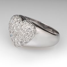 This lovely diamond ring features a heart design and accented with fifty-three (53), bead set, round brilliant cut diamonds. The ring measures 14.0mm at the top, rises 6.5mm above the finger, tapering to 4.2mm wide and 1.2mm thick at the base of the shank. The ring is currently a size 8. Luxury Heart Shaped Diamond Ring For Formal Occasions, Luxury Heart-shaped Diamond Ring, Luxury White Diamond Heart Ring, Heart-shaped Brilliant Cut Diamond Ring For Proposal, Formal Heart-shaped Diamond Ring, Heart-shaped Brilliant Cut Diamond Ring, Heart Shaped Brilliant Cut Diamond Ring, Luxury Heart Ring With Halo Setting, Diamond Heart Ring With Diamond Accents