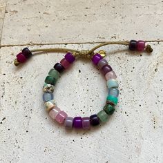 These bracelets and necklaces are a collection based around a rainbow of gemstone pony beads. Add-on stones can be purchases additionally here, please specify if you want your add on strung on your bracelet in the personalization comments. If left blank it will be sent separately: https://www.etsy.com/listing/946252171/bracelet-add-ons?ref=shop_home_active_4 All of my cords are one size fits all. Stones are subject to availability and may be substituted when necessary. Precious gems are formed in different ways and composed of different materials, meaning their appearances vary vastly. Gems may be treated to enrich color. Recommended to be stacked with many! Beaded with love ❤️. Bracelets And Necklaces, Season Of The Witch, Gemstone Beaded Bracelets, The Witch, Pony Beads, Add Ons, Precious Gems, A Rainbow, Shop Home