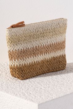 Bring some brightness to the beach with you this summer in Shiraleah's Formentera Zip Pouch. Made of paper straw, this cosmetic pouch is the perfect poolside companion. Pair with the matching Formentera Tote and other items from Shiraleah to complete your look! Summer Beige Pouch Beach Bag, Beige Pouch Beach Bag For Summer, Beige Straw Pouch Bag For Beach, Spring Pouch Beach Bag, Beige Pouch Straw Bag For Beach, White Pouch Straw Bag For Beach, Beige Pouch Straw Bag For The Beach, Summer Vacation Straw Pouch Bag, Summer Pool Bags For Vacation