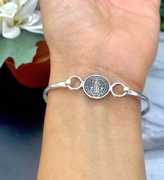 oval Bangle bracelet  Saint Benedict  Made out of Authentic sterling silver from mexico Stamped: 925 It has a hook style closure next to the image Oval Bangle, Saint Benedict, St Benedict, A Hook, Infinity Bracelet, Bangle Bracelet, Sterling Silver Bracelets, Silver 925, Bangle Bracelets