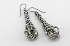 These earrings are made by hand from small interconnected surgical steel rings. They're very strong, durable and resistant to water, sweat, chemicals, saltwater, UV... The material doesn't cause any problems even to people with sensitive skin or allergies, since the hooks too are made of surgical steel. Hooks may be either regular french hooks, or locking hooks.   Lenght including hooks: 7cm Weight: 8,35g/each Shipped in a gift box.  --The earrings are made of a weave called Persian by using pro Modern Dangle Earrings With Hook And Links, Modern Metal Earrings With Hook Style, Modern Metal Earrings With Hooks And Links, Gift Drop Earrings With Hooks And Links, Silver Link Earrings For Everyday, Everyday Silver Link Earrings, Metal Earrings With Box Chain For Gift, Box Chain Link Earrings As Gift, Everyday Metal Earrings With Box Chain