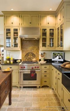 a kitchen with an oven, sink and counter tops in it's center island