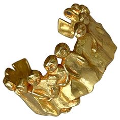 A gilt bronze bracelet by Line Vautrin (1913-1997), circa 1945-46. The design is known as "La Manif" or "La Manifestation", which features a chain of arm-linked figurines. Monogrammed on the back. It is a bespoken piece by one of the most creative Parisian art jeweler who infused history, iconography and a sense of humor in her work. The inner circumvention is 18cm about 7.2 inches. For reference of "La Manif": Line Vautrin: Sculptor, Jeweler, Magician by Line Vautrin and Patrick Mauries; Thames and Hudson. Page 50. Sculptural Bracelet, Line Vautrin, Art Parisien, French Mid Century Modern, Parisian Art, Bronze Bracelet, Ancient Jewellery, Bronze Bracelets, Sense Of Humor