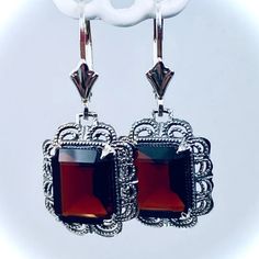 These are Victorian reproduction earrings in sterling silver set with stunning Natural wine red garnet gemstones. Each festoon earring is 28mm x 13mm in dimension with post-backs. The earrings are 1 and 1/4 inches long with lever-backs (28mm long). Each gemstone is 10mm x 8mm and are 3.8ct each. The earrings closures are a choice of ear wires, deco-posts, or lever-backs. Most popular for this earring are the posts-backs and the lever-back style for comfortable wear, and to prevent loss. Classic Red Earrings For Party, Handmade Red Earrings For Formal Occasions, Classic Red Party Earrings, Ornate Red Earrings For Party, Classic Red Nickel-free Earrings, Red Art Deco Jewelry For Formal Occasions, Classic Red Dangle Earrings, Ornate Red Earrings For Formal Occasions, Elegant Red Earrings With Ear Wire