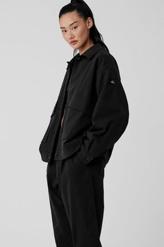 Made from a softly structured cotton blend, the One Up Jacket has a cool, utility-style look. It’s baggy and boxy in the best way (size down if you prefer a closer fit) with a point collar, matte buttons and oversized flap pockets. Balance the tomboy chic with a mini skirt, or go all in with the coordinating Road Trip Trouser. Oversized Button-up Utility Jacket For Streetwear, Black Shacket With Pockets For Streetwear, Oversized Utility Shacket, Black Long Sleeve Outerwear By Alo Yoga, Casual Black Alo Yoga Outerwear, Black Long Sleeve Alo Yoga Outerwear, Alo Yoga Black Long Sleeve Outerwear, Black Collared Shacket For Streetwear, Utility Collared Shacket For Streetwear