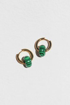 PRODUCT DESCRIPTION Introducing our Basic Hoop Earrings – a timeless accessory redefined with a touch of nature's charm. These classic hoops feature a delicate malachite charm, adding a subtle yet sophisticated element to your style. Natural Gemstone Earrings Water Resistant 18k Gold-plated on High Quality Brass Natural Malachite Stone Size: 1.5cm diameter Weight: 6g each Read our full Jewellery Care Guide here Read our Sizing Guide here Minimalist Green Hoop Huggie Earrings, Green Minimalist Small Hoop Huggie Earrings, Green Minimalist Huggie Hoop Earrings, Green Tarnish-resistant Hoop Jewelry, Minimalist Green Hoop Earrings, Malachite Stone, Beautiful Gift Wrapping, Timeless Accessories, Pearl Choker