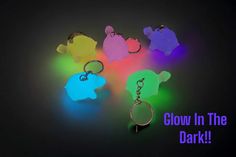 glow in the dark keychains with different colors and shapes, including an elephant