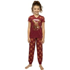 Head off to Hogwarts School of Witchcraft and Wizardry in this Harry Potter 'Hogwarts Crest' Jogger Pajama Set. Fans of the books and movies will love this 2 piece short sleeve pajama set that features the Hogwarts crest in gold foil print on a burgundy short sleeve top and an all over golden yellow Hogwarts crest and star pattern on the joggers and sleeves. Made of 100% polyester, this 2 piece pajama jogger is for sleep, play or just hanging around the castle! For questions regarding sizing, pl Harry Potter Pyjamas, Mens Silk Pajamas, Hogwarts Outfits, Books And Movies, Harry Potter Girl, School Of Witchcraft, Harry Potter Kids, Hogwarts Crest, Burgundy Shorts