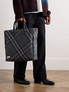 Burberry's tote bag is perfectly sized to fit the essentials for long work commutes or overnight trips.Topped with sturdy handles, it's jacquard-woven with the house's signature checks and features an internal zipped pocket to keep smaller items organised. There's enough space for a change of clothes plus a laptop and water bottle. Use the optional shoulder strap to wear it cross-body. Tote Bag For Men, Burberry Tote Bag, Burberry Tote, Wardrobe Edit, Luxury Sneakers, Loungewear Shorts, Classic Sneakers, Suede Jacket, Espadrille Shoes