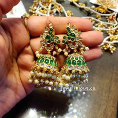 Gold Finish Green Parrot Kemp Stone Jhumkas. It is handcrafted with AD and green kemp stones with two-layer pearl hangings, pushpin Type closure. Premium quality. Green Hand Set Chandbalis For Festivals, Green Jhumkas With Stone Work, Green Hand-set Jhumkas For Festive Occasions, Green Hand Set Jhumkas For Festivals, Green Hand Set Chandbalis For Celebration, Hand Set Green Chandbalis For Celebration, Festive Green Hand-set Jhumkas, Festival Green Hand Set Chandbalis, Green Temple Jewelry Jhumkas With Cutdana