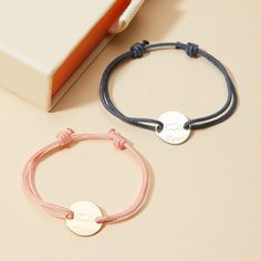 A gift for a little one to treasure, this Merci Maman x Mellipou Personalized Mini Pastille Bracelet is the ultimate sentimental keepsake. Each bracelet is a reminder of mom's unconditional love to treasure throughout the years as they grow. Customize with a bracelet braid in their favorite color and add names and dates to a shiny disc, engraved with the Mellipou logo.&nbsp;18K Champagne Gold Plated or 925 Sterling SilverMini Pastille Charm: 0.4x0.4Braid made of a durable, colourfast polyest Bracelet Logo, Crystal Dice, Flower Guide, Birth Gift, Grandmother Gifts, Crystal Stars, Sliding Knot, Champagne Gold, Unconditional Love