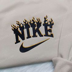 Black Flame Nike Embroidered Sweatshirt, Nike Inspired Embroidered Hoodie, Unique Embroidered Shirt Our clothing store is proud to offer a wide range of high-quality embroidered clothing that combines style and comfort. Among our selection of embroidered garments, our black flame Nike embroidered sweatshirt stands out as a must-have for anyone who wants to make a... Nike Fire Sweatshirt, Nike Embroidered Sweatshirt, Nike Inspired, One Piece Hoodie, Sweatshirt Nike, Black Flame, Olivia Rose, Nike Sweatshirts, Custom Nikes