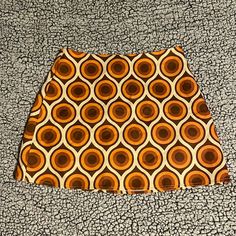 Nwot Cider Mini Skirt, Size Medium, Retro Pattern, Brown/Orange/Amber/Cream Colored, Polyester Material, No Stretch Retro Brown Mini Skirt, Retro Brown Skirt, Retro Fitted Brown Skort, Orange Retro Mini Skirt, Orange Fitted Retro Mini Skirt, Fitted Retro Orange Mini Skirt, Trendy Lined Orange Mini Skirt, Retro Orange Mini Skirt For Spring, Trendy Orange Lined Mini Skirt