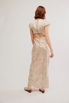 Embrace your inner butterfly with the Free People Butterfly Babe Maxi Dress! This stunning polka dot dress features a classic A-line silhouette and a beautiful butterfly lace neckline. With its exposed back detail and defined cap sleeves, it's perfect for any occasion. Let your style take flight with this timeless dress. 100% Polyester Embroidery: 100% Polyester Trim: 100% Nylon Spring Fitted Maxi Dress With Cutout Back, Spring Midi Dress With Keyhole Back, Fitted Maxi Dress With Cutout Back For Spring, Midi Length Spring Dress With Keyhole Back, Feminine Fitted Maxi Dress With Tie Back, Fitted Tie-back Feminine Maxi Dress, Fitted Midi Dress With Keyhole Back For Summer, Daywear Backless Dress With Lace Trim, Spring Brunch Dress With Keyhole Back