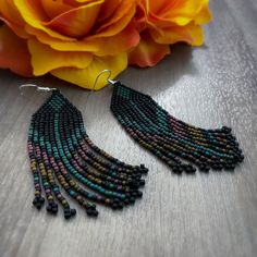 Southwestern style beaded fringe earrings made with Toho seed beads. Beaded Fringe Dangle Tassel Earrings For Festival, Southwestern Beaded Earrings With Tassels For Festival, Southwestern Beaded Fringe Dangle Earrings, Southwestern Fringe Earrings With Round Beads, Southwestern Fringe Dangle Earrings, Southwestern Style Beaded Fringe Dangle Earrings, Beaded Fringe Earrings With Round Beads For Festivals, Southwestern Fringe Jewelry With Round Beads, Festival Beaded Fringe Earrings With Round Beads