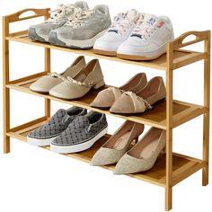 three tiered shoe rack with four pairs of shoes on top and one pair below