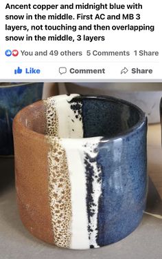 a blue and white ceramic bowl sitting on top of a counter next to other bowls