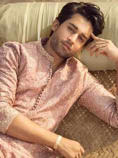 <p><strong>Kurta<br /></strong>Color: Apricot<br />Designer embroidered raw silk kurta front, collar, sleeves on all over<br /><br /><strong>Inner:</strong><br />Comes with matching pajama</p> <p><br /><strong>Additional Accessories:<br /></strong>Peshawari Sandal / Khussa: <strong>US$30<br /></strong>Men's Plain Shawl: <strong>US$50</strong></p> Traditional Long Sleeve Churidar For Navratri, Semi-stitched Chanderi Sherwani With Long Sleeves, Festive Long Sleeve Chikankari Bandhgala, Festive Long Sleeve Bandhgala With Chikankari Embroidery, Pink Chanderi Sherwani For Eid, Semi-stitched Long Sleeve Kurta With Intricate Embroidery, Long Sleeve Churidar With Resham Embroidery For Diwali, Diwali Churidar With Resham Embroidery And Long Sleeves, Festive Pink Chanderi Sherwani