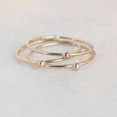 ONE dainty (1mm) solid 14k gold stacking band is adorned with a teensy 14k gold droplet.  Small and dainty, stack several as a set or wear with some of the other stacking rings in our collection for variety.  We think you could love these, too:►Sterling SILVER tiny droplet ring: http://etsy.me/1x03Qe2►Gold GEMSTONE stacking ring:  http://etsy.me/1zpjYI0►Gold INITIAL ring:  http://etsy.me/1gamTHo** Enjoy browsing our shop: http://etsy.me/1mC0gmu **{YOU CAN SAVE!} Think bridesmaids, gifts, keep on Minimalist Stackable 14k Gold-filled Toe Rings, Minimalist 14k Gold-filled Stackable Toe Rings, Delicate Tiny Stackable 14k Gold Rings, Minimalist 14k Gold Filled Stackable Toe Rings, Dainty 14k Gold Stackable Toe Rings, Minimalist Stackable 14k Gold Filled Midi Rings, Minimalist 14k Gold Filled Stackable Midi Rings, Stackable Minimalist Midi Rings In 14k Gold Filled, Minimalist Stackable 14k Gold Filled Rings