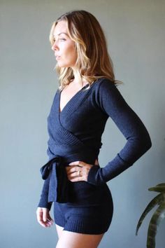 Wrap yourself in warmth with this elegant ballerina shrug, crafted from soft Merino wool. Featuring long double knit ties, an off-the-shoulder ribbed neckline, and fitted sleeves (24"), this cropped style is perfect for layering over a sleeveless dress or camisole on chilly nights. The fixed body length is 16", shown on a 5'9" model with measurements 36"/30"/39" in size Small. Handmade in the USA and made to order in 1-2 weeks. Hand wash only and lay flat to dry. Chic Wrap Top For Winter, Fitted Wrap Top For Winter, Chic Winter Wrap Top, Versatile Fitted Wrap Top, Chic Fall Wrap Top For Brunch, Versatile Fitted Wrap Top With Tie Waist, Fitted Versatile Wrap Top With Tie Waist, Fitted Wrap Top With Tie Waist, Fitted Knit Wrap Top