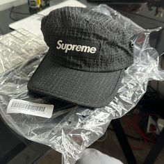 Supreme Glow Ripstop Camp Cap New With Barcode And Original Packaging Adjustable Windproof Black Baseball Cap, Black Flat Bill Hiking Hat, Black Flat Bill Hat For Hiking, Casual Black Baseball Cap For Camping, Black Functional Baseball Cap For Outdoor, Functional Black Baseball Cap For Outdoor, Black Snapback Baseball Cap For Camping, Black Nylon Bucket Hat, Black Baseball Cap For Camping